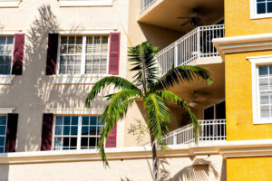 Installer fitting premium impact-resistant windows in Naples FL