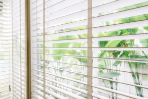 Accordion hurricane shutters closed for storm protection