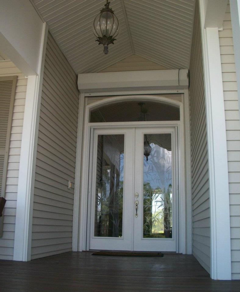 Impact French doors with roll-down hurricane shutter above