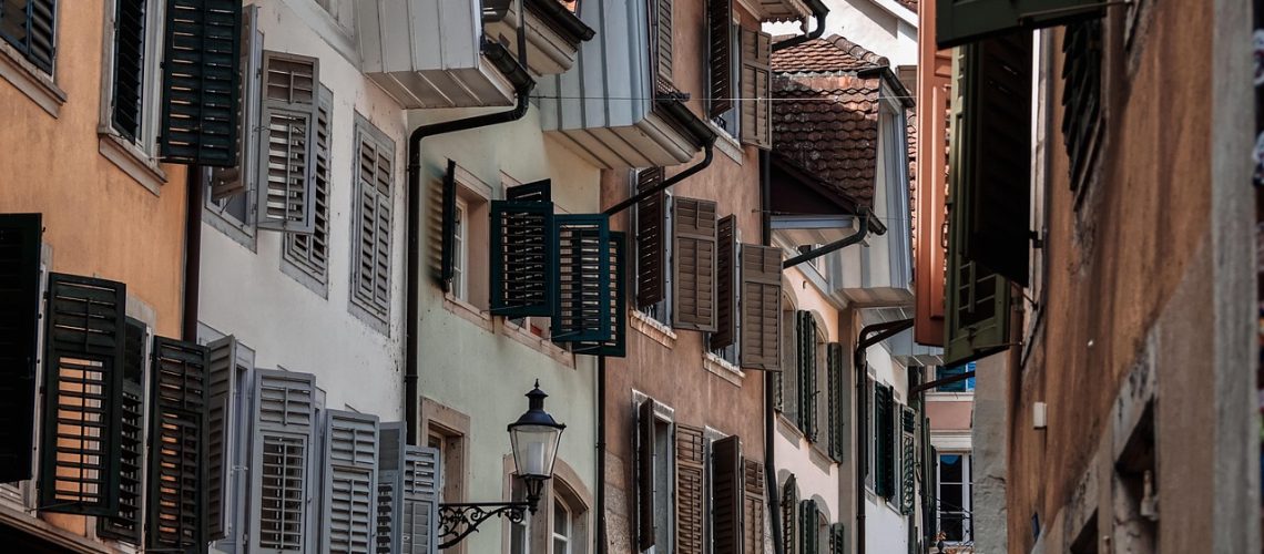 Home with impact-resistant windows installed for storm protection